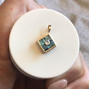 14k yellow gold aquamarine and diamond pendant.